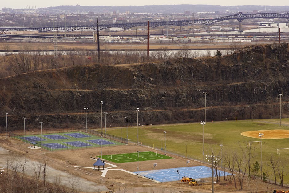 Scenic view of the Belem Tower with lined scooters in Lisbon, Portugal on a cloudy day.